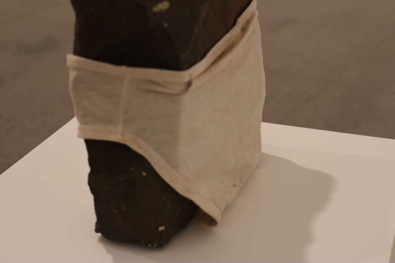 Linda Marrinon, _Rock with underpants_ 1992, bluestone and cotton, 31.5 x 22.5 x 13.0 cm (irregular).